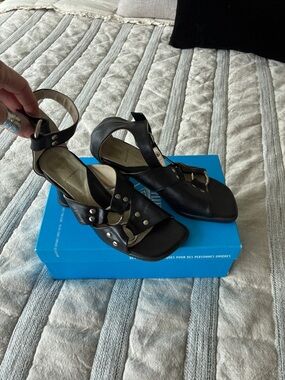 John Fluevog Black Leather Ankle-Strap Heels with Metal Accents